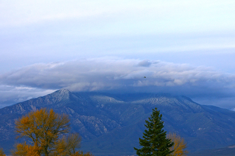 A giant UFO conceals itself atop Taos Mountain