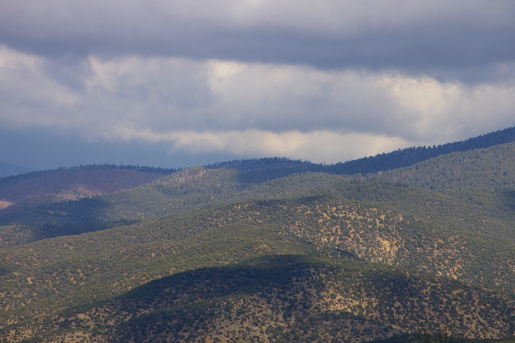 Clouds and shadows on the hills just east of Taos.