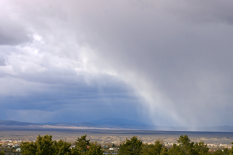 Sunlit snow shower near Taos, New Mexico