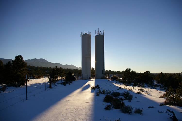 water towers at sunset