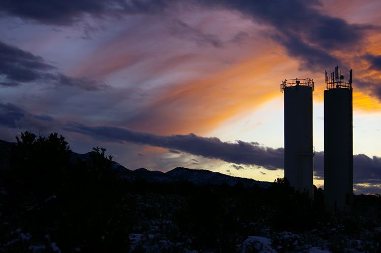 water towers at sunset