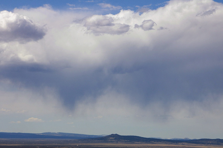 Virga over extinct volcanoes west of Taos, New Mexico.