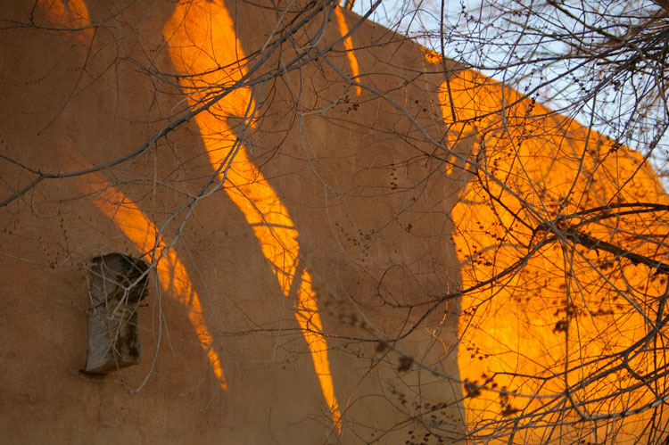 shadows on adobe wall