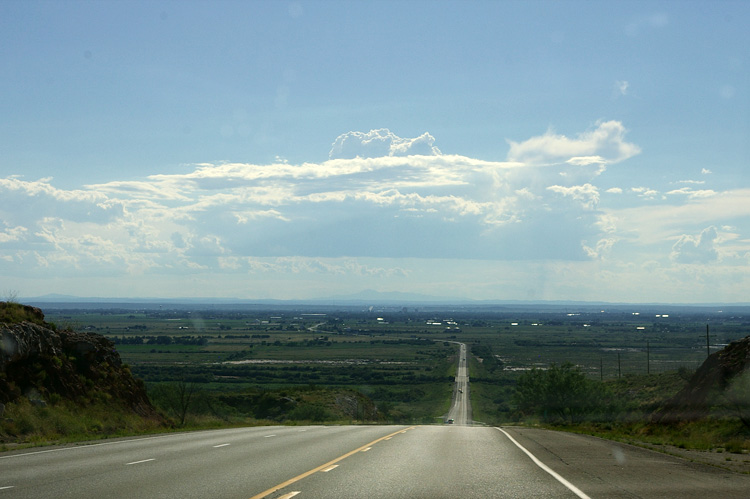 Roswell, NM ahead in the haze from a hill just east of town