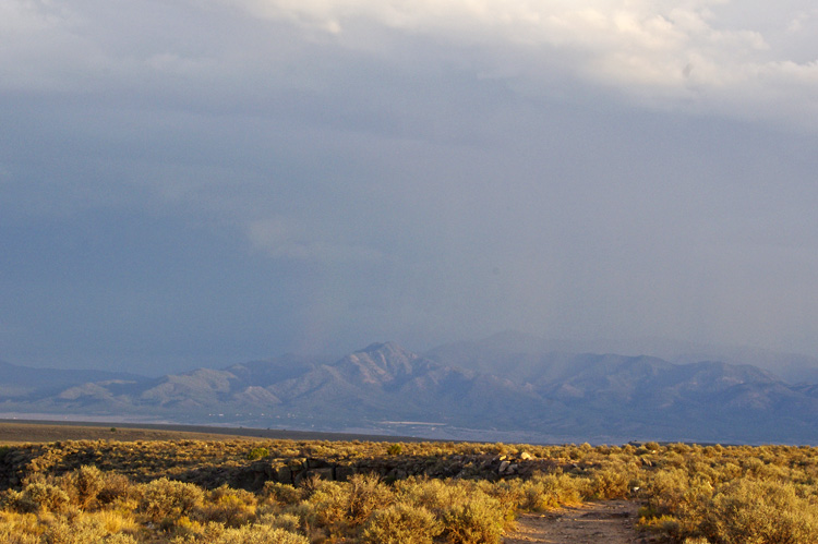 Rain on Picuris Peak as seen from the Rio Grande Gorge Bridge area.