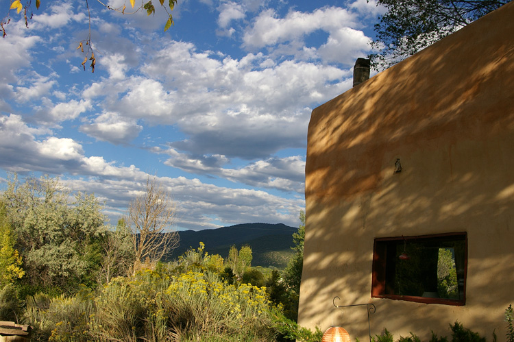 Clouds and shadows on an old adobe in Taos